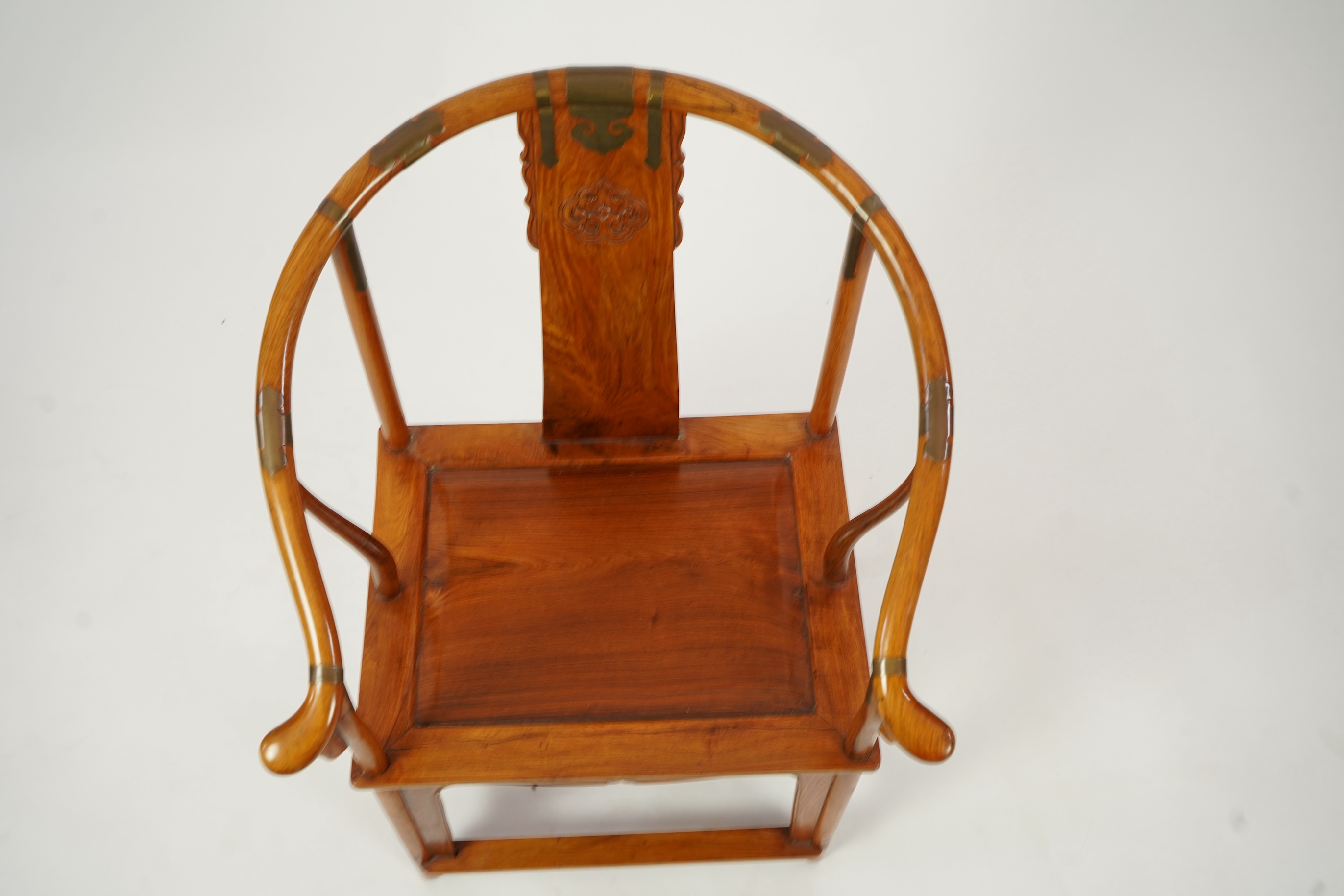 A Chinese huanghuali and brass mounted horseshoe-back armchair, quanyi, late 19th century